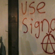 Grafitti spray-painted on a wall telling people to use the encrypted messaging App Signal during a protest at UC Berkeley. (February 1, 2017)